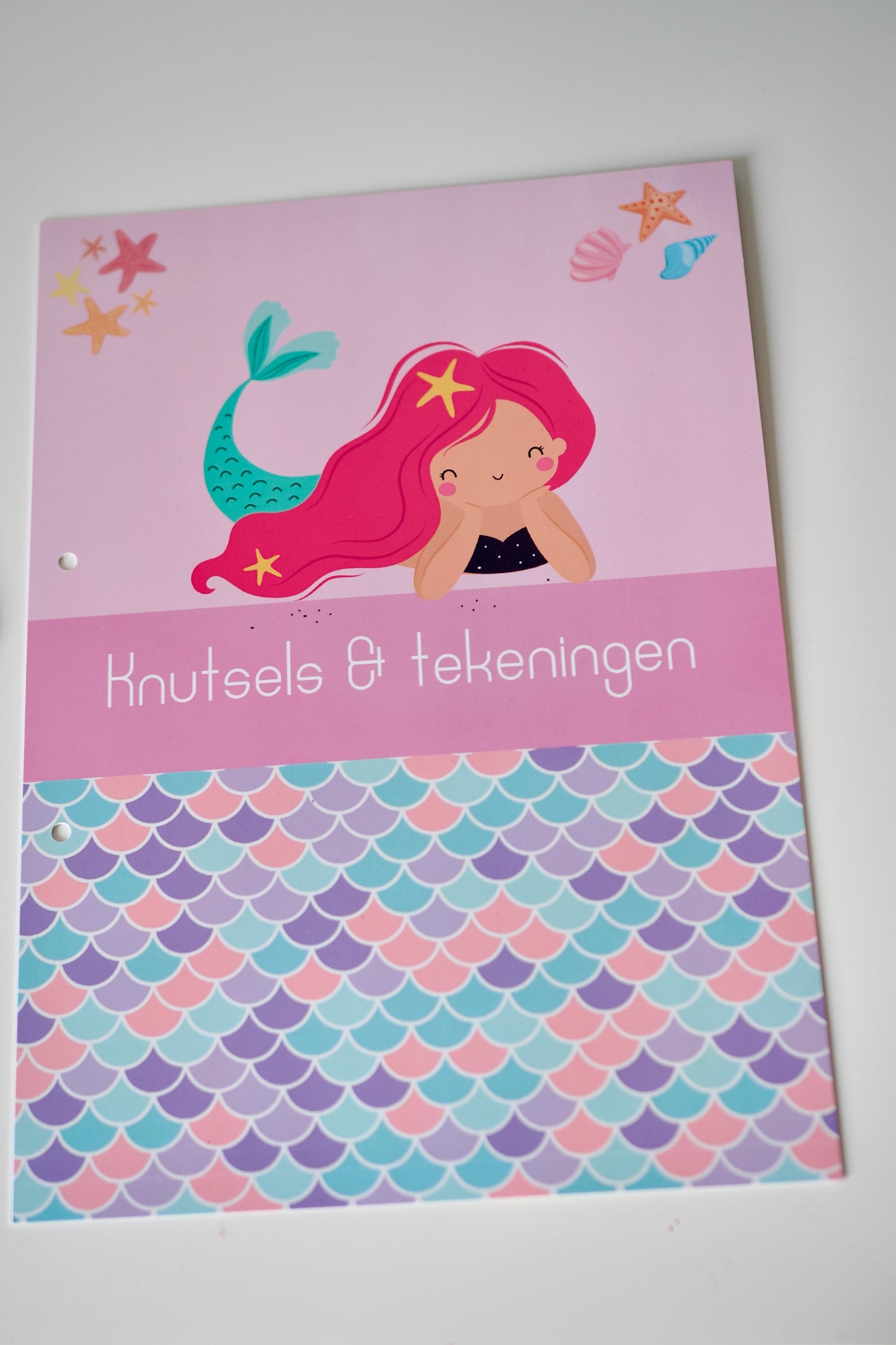 Knutsels en tekeningen bewaarbundel zeemeermin